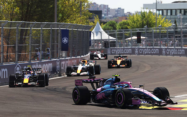 Franco Colapinto of Argentina driving the Alpine F1 A526 Mercedes leads Liam Lawson of New Zealand driving the Oracle Red Bull Racing RB22 Red Bull...