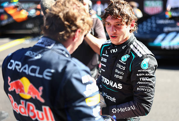 Race winner Andrea Kimi Antonelli of Italy and Mercedes AMG Petronas F1 Team and Second placed Max Verstappen of the Netherlands and Oracle Red Bull...