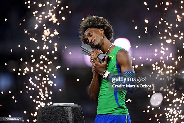 Alison Dos Santos of Team Brazil celebrates with his World Athletics Ultimate Championship trophy after victory in the Men's 400 Metres Hurdles Final...
