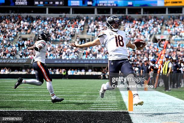Caleb Williams of the Chicago Bears celebrates after scoring a touchdown during the first quarter against the Carolina Panthers of the game at Bank...
