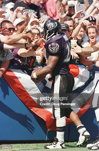 Earnest Byner of the Baltimore Ravens celebrates his game winning fourth quarter touchdown with the fans in ''The Birdcage'', Baltimore''s answer to...