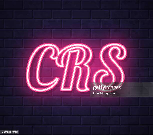 crs - common reporting standard - glowing neon text on brick wall background - chrome font stock illustrations