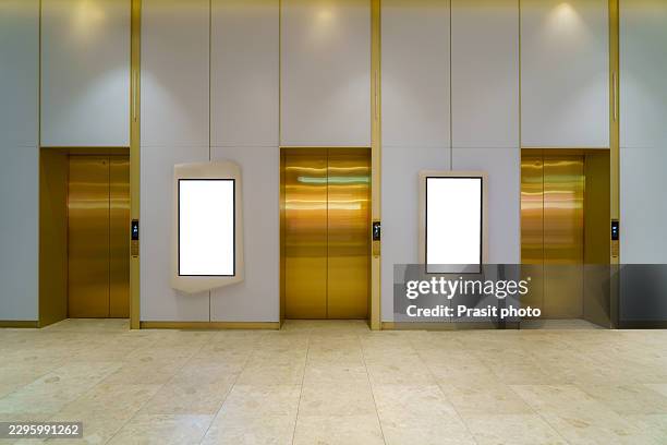 blank digital display mockups next to modern elevator - digital elevator screen stock pictures, royalty-free photos & images