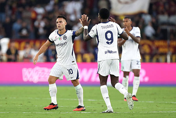 Lautaro Martinez of FC Internazionale Milano celebrates scoring his team’s first goal with teammate Marcus Thuram of FC Internazionale Milano during...