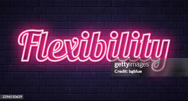 flexibility - glowing neon text on brick wall background - adaptable stock illustrations
