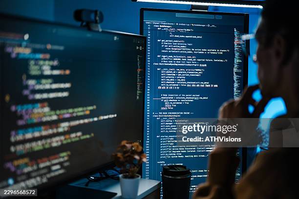 software developer reviewing source code on large screen - javascript stock pictures, royalty-free photos & images