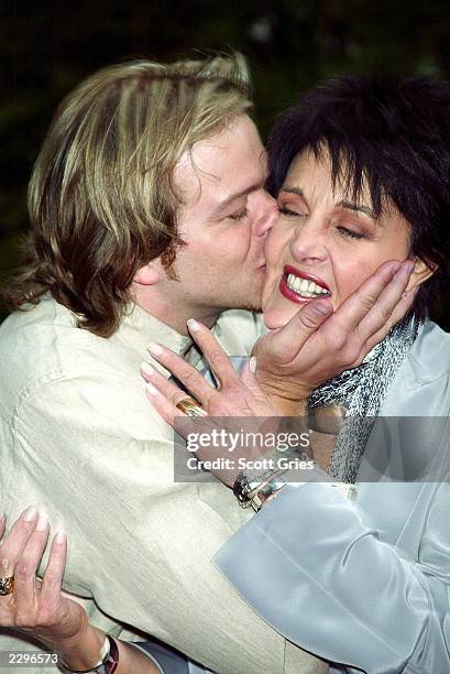 Actor Brian Gaskill kisses Linda Dano at a party hosted by mayor Michael Bloomberg to celebrate the 30th Annual Daytime Emmy Awrds May 15, 2003 at...