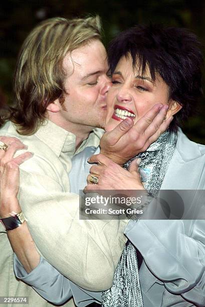 Actor Brian Gaskill kisses Linda Dano at a party hosted by mayor Michael Bloomberg to celebrate the 30th Annual Daytime Emmy Awrds May 15, 2003 at...