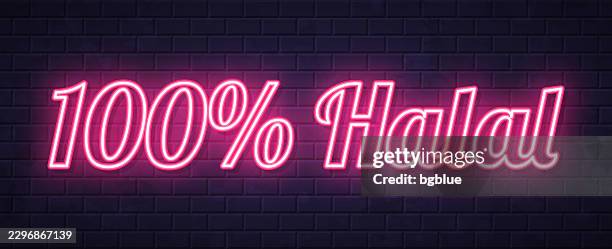 100% halal - glowing neon text on brick wall background - halal stock illustrations