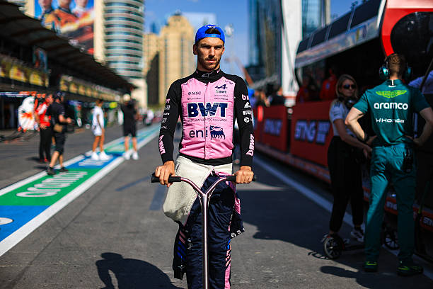 Pierre Gasly of France and Alpine F1 Team travels by scooter in the pit lane during the F1 Grand Prix of Azerbaijan at Baku City Circuit on September...