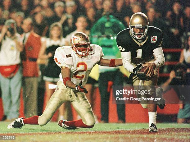 DERRICK MAYES OF NOTRE DAME, #1, PULLS DOWN A TOUCHDOWN RECEPTION OVER SAMARI ROLLE, #2, OF FLORIDA STATE DURING THE THIRD QUARTER OF THE FEDEX...