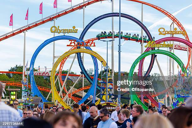 five loop roller coaster at oktoberfest in munich - rollercoaster loop stock pictures, royalty-free photos & images