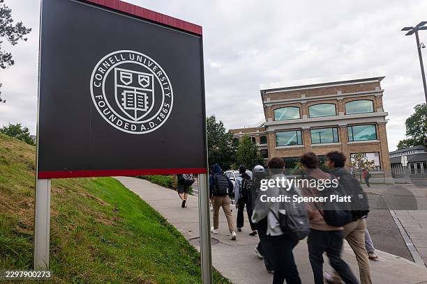 Students walk on the campus of Cornell University a day after on September 30 in Ithaca, New York. A New York state attorney general has announced a...