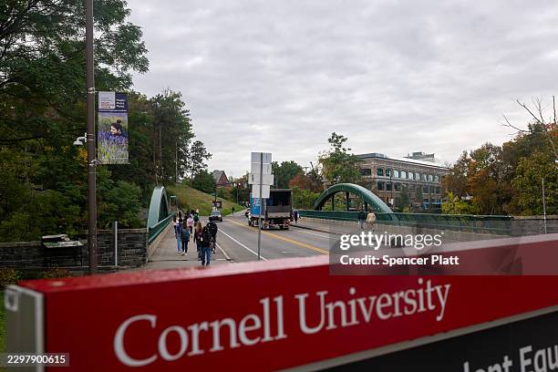 Students walk on the campus of Cornell University a day after on September 30 in Ithaca, New York. A New York state attorney general has announced a...