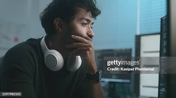 software developer, stressed male office worker thinking while looking at a computer screen - javascript stock pictures, royalty-free photos & images