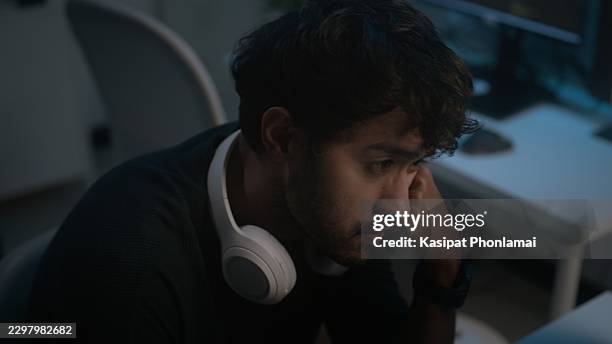 software developer, stressed male office worker thinking while looking at a computer screen - javascript stock pictures, royalty-free photos & images