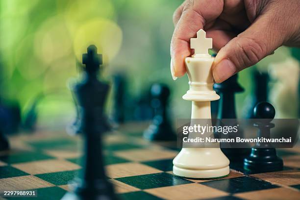 the chess checkmate with white king piece for strategy concept. - advanced tactical fighter stock pictures, royalty-free photos & images
