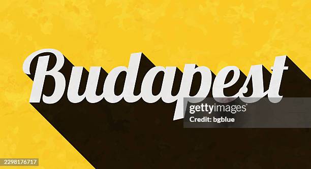 budapest - text with long shadow on textured yellow background - budapest stock illustrations