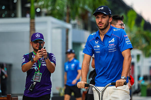 Pierre Gasly of France and Alpine F1 Team travels in the paddock on a scooter during practice ahead of the F1 Grand Prix of Bahrain in Malaysia at...