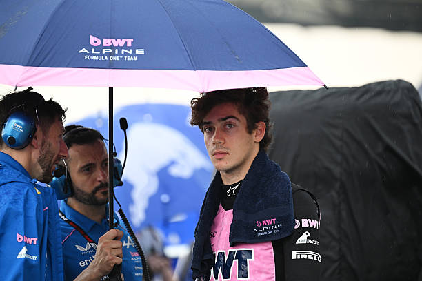 Franco Colapinto of Argentina and Alpine F1 under an umbrella on the grid prior to the F1 Grand Prix of Bahrain in Malaysia at Sepang Circuit on...
