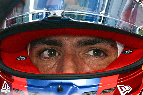 Williams' Spanish driver Carlos Sainz sits in his car in the pits during a practice session ahead of the Formula One Singapore Grand Prix at the...