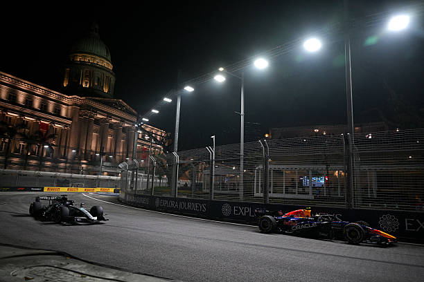 Mercedes' British driver George Russell and Red Bull Racing's French driver Isack Hadjar steer their cars during the sprint qualifying session ahead...