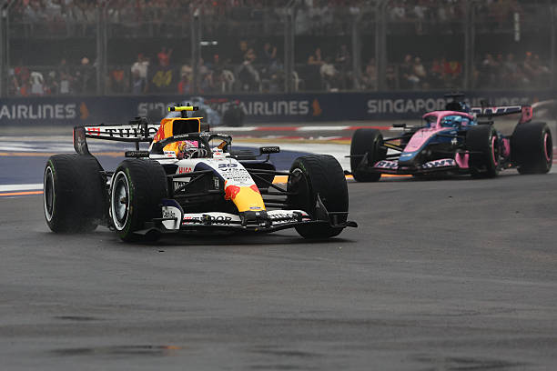 Liam Lawson of Racing Bulls and Pierre Gasly of Alpine during the Sprint ahead of the Formula 1 Singapore Grand Prix at Marina Bay Street Circuit in...