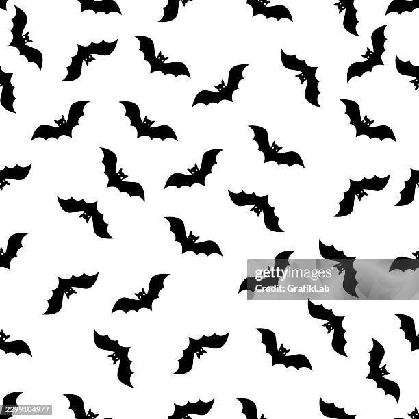 repeating black halloween bat pattern on white background - bats flying isolated stock illustrations