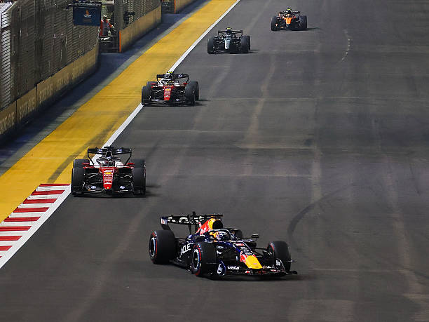 Red Bull driver Max Verstappen takes leading position during the Race at the Formula One Grand Prix of Singapore, at the Marina Bay Street Circuit in...