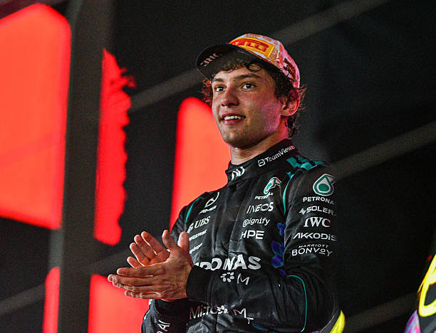 Kimi Antonelli celebrates after finishing third in the Formula 1 Singapore Airlines Singapore Grand Prix at the Marina Bay Street Circuit in...