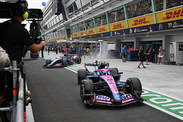 Franco Colapinto of Argentina driving the Alpine F1 A526 Mercedes and Pierre Gasly of France driving the Alpine F1 A526 Mercedes levae the garage...