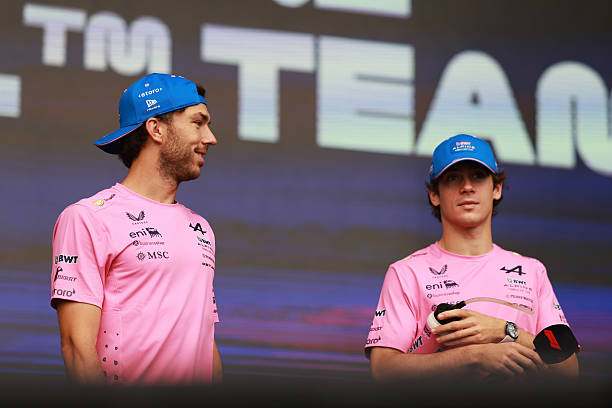Pierre Gasly of France and Alpine F1 and Franco Colapinto of Argentina and Alpine F1 look on from the fan stage prior to the Sprint ahead of the F1...