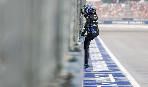 George Russell of Great Britain and Mercedes AMG Petronas F1 Team walks away from the car after crashing out of the race during the Sprint ahead of...
