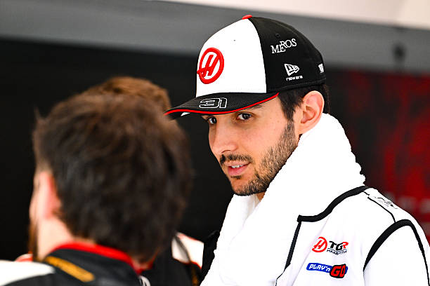 Esteban Ocon of France and Haas F1 looks on in the garage during the Sprint ahead of the F1 Grand Prix of Singapore at Marina Bay Street Circuit on...