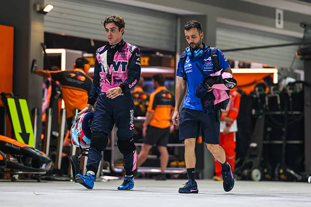 Franco Colapinto of Argentina and Alpine F1 Team walks in the pitlane during Qualifying ahead of the F1 Grand Prix of Singapore at Marina Bay Street...