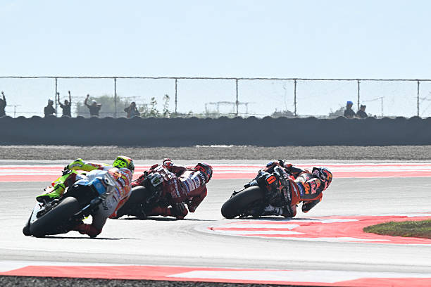 Marc Marquez of Spain riding the Lenovo Ducati and Pedro Acosta of Spain riding the Red Bull Factory KTM battle for position during the MotoGP Race...