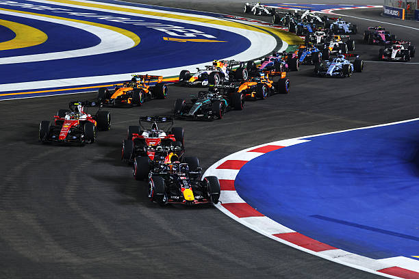 Max Verstappen of the Netherlands driving the Oracle Red Bull Racing RB22 Red Bull Ford Powertrains leads the field into turn one at the start during...