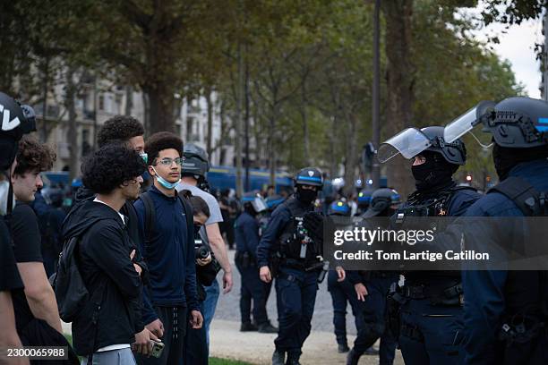 Image Sandgi Protesters and police officers face each other at Place Vauban during ...
