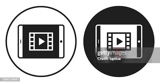 watch video on tablet. round icon - black and white circle button - streaming services stock illustrations