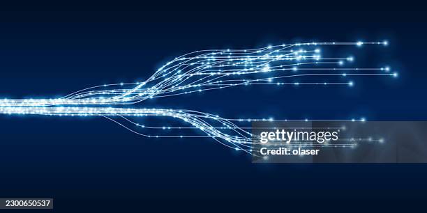 glowing blue light trails stream across a dark navy background, branching into two curved paths with bright sparkling points and a sleek futuristic appearance. - server lights stock illustrations