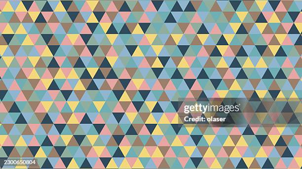 a colorful surface covered with a repeating pattern of small equilateral triangles in pastel blue, pink, yellow, teal, and black tones arranged in a uniform grid. - colored pencil background stock illustrations