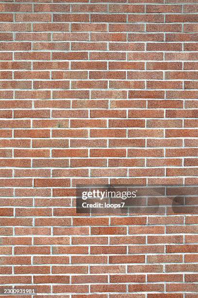 red brick wall texture with horizontal masonry pattern and gray mortar joints - red brick surface stock illustrations