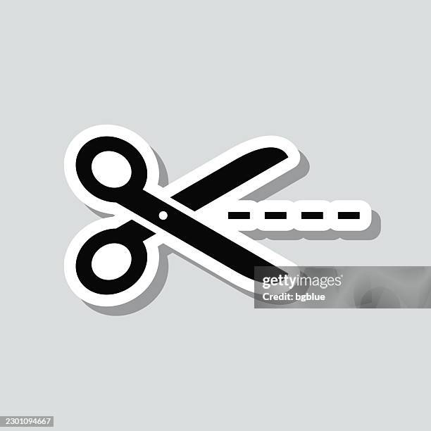 scissors cutting dotted line. icon sticker on gray background - paper guillotine stock illustrations