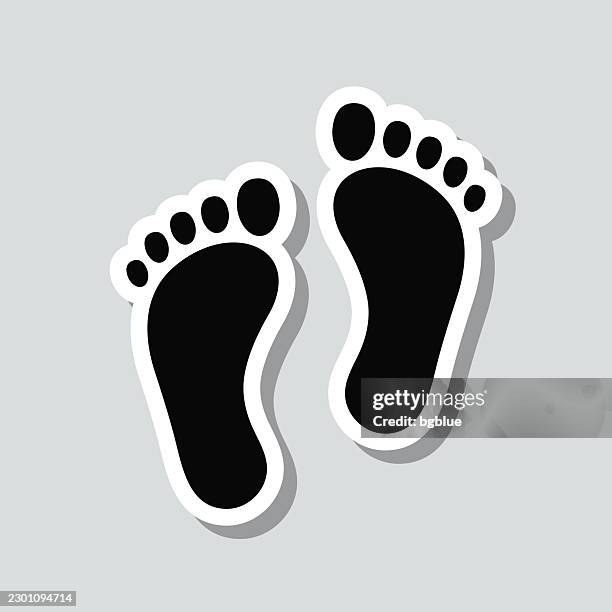 footprints. icon sticker on gray background - public footpath stock illustrations