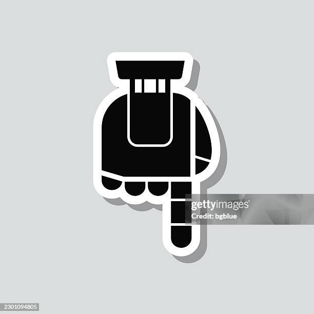 robotic pointing down. icon sticker on gray background - bionic hand stock illustrations