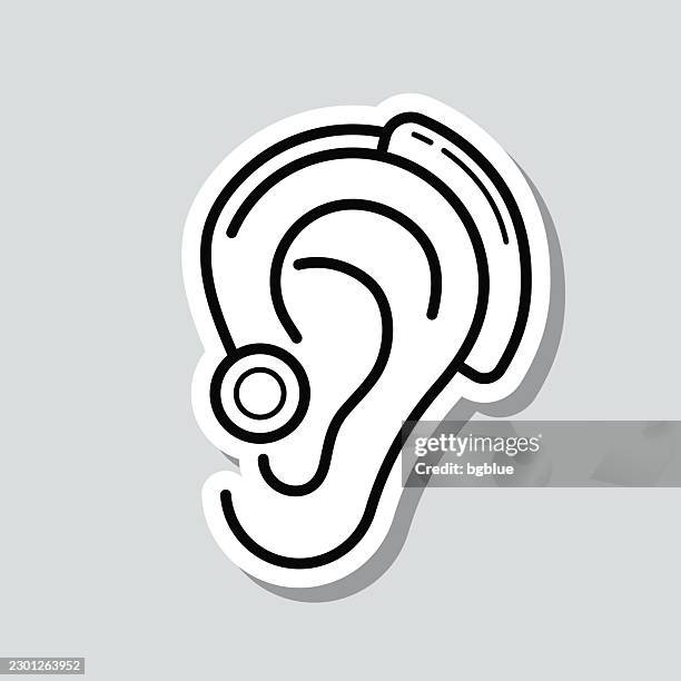 cochlear implant. icon sticker on gray background - cochlear implant stock illustrations