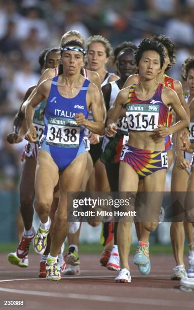 Wang Junxia of China, #3154, in action during the womens 5,000 heats at the Olympic Stadium at the 1996 Centennial Olympic Games in Atlanta, Georgia....