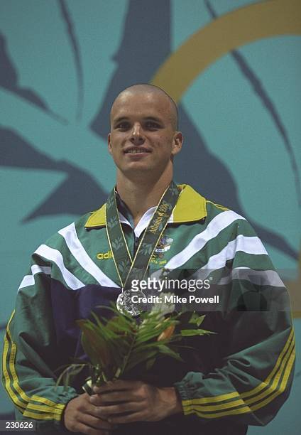 Scott Miller of Australia wins the silver in the men''s 100m butterfly final at the Georgia Tech Aquatic Center at the 1996 Centennial Olympic Games...