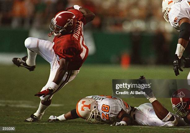 ALABAMA TAILBACK DENNIS RIDDLE RUNS OUT OF ROOM AFTER BEING TRIPPED UP BY TENNESSEE SAFETY RAYMOND AUSTIN DURING THE VOLUNTEERS 41-14 VICTORY OVER...