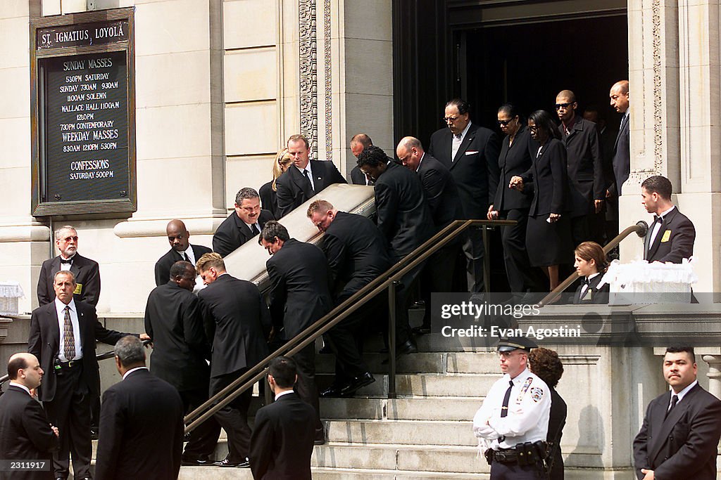 R&B singer Aaliyah's coffin being carried out of St. Ignatius Loyola